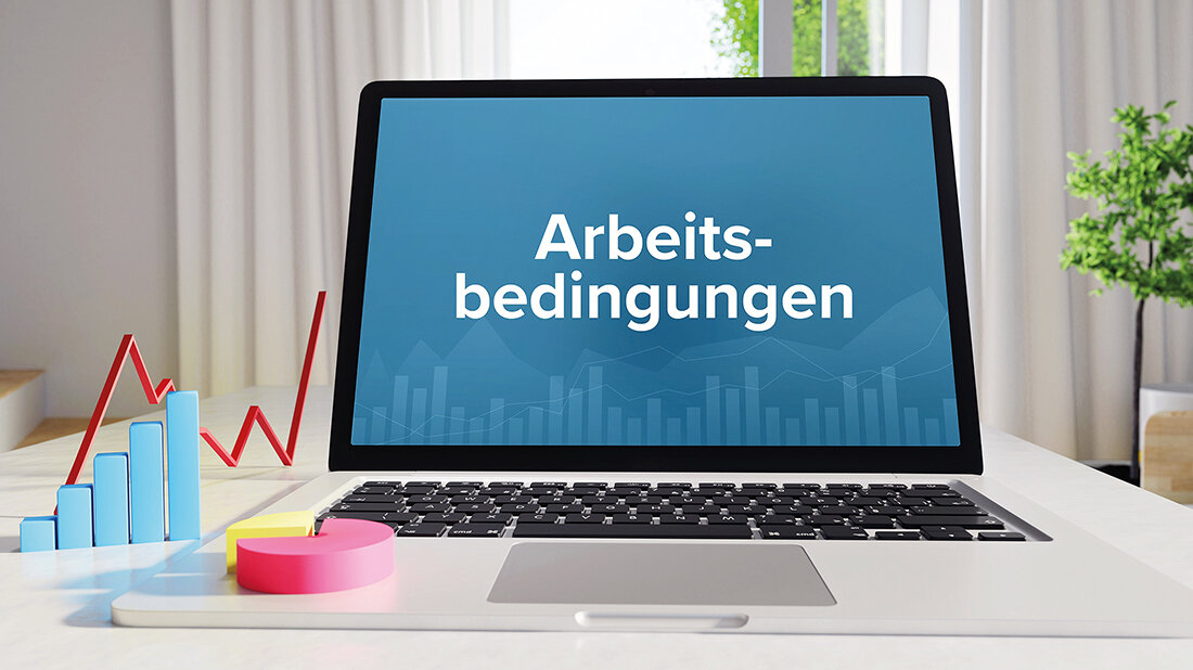 Abbildung eines Laptop-Displays, auf dem das Wort „Arbeitsbedingungen“ steht