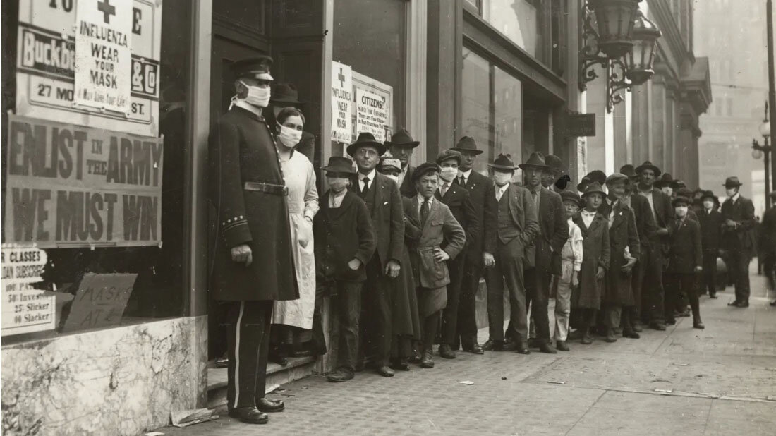 Spanische_Grippe.jpg Schlange von Menschen während der Spanischen Grippepandemie 1918